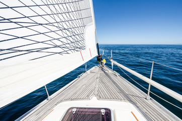 The bow of a sailboat at sea