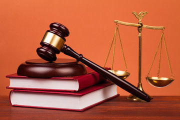 judge gavel,books and scales of justice on table