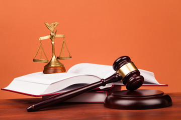 judge gavel,books and scales of justice on table