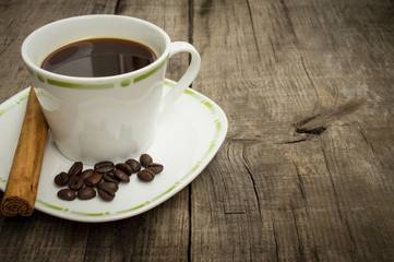Coffee Cup with beans and cinnamon stick