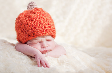 newborn in a cap