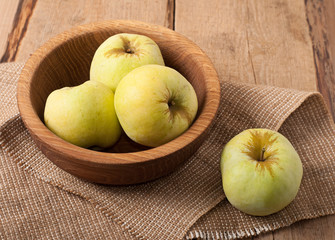 Antonovka apples on wooden dish