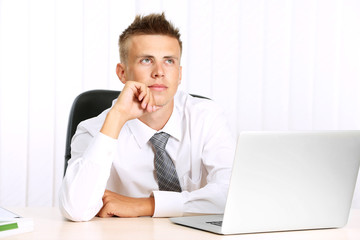 Portrait of young businessman in office