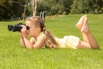 Girl Lokking in Binoculars
