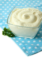 Sour cream in bowl close-up