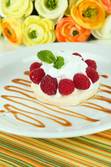Tasty meringue cake with berries, close up