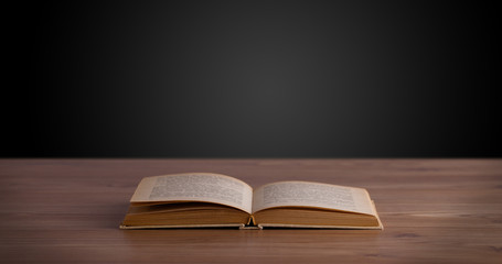 Open book on wooden deck