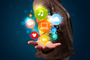 Young woman presenting colorful technology icons and symbols