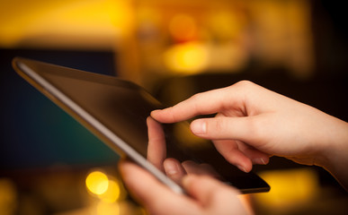 Finger pointing on tablet pc with empty space