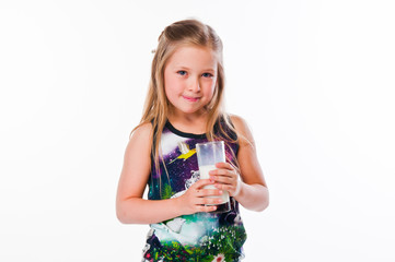 beautiful little girl with a glass of milk