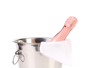 Bottle of champagne in cooler.