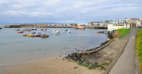 Fototapeta na wymiar Small harbour with boats in the Portrush city, Northern Ireland.