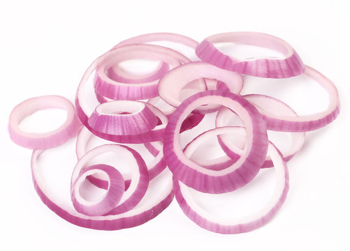 Rings of red onion on white background