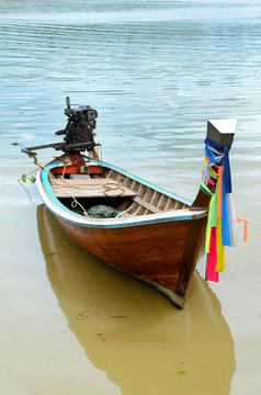 Fishing boat on the shore at low tide.