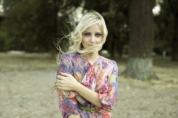 Fototapeta premium beautiful girl in the Park with developing hair