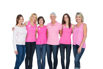 Obraz premium Smiling women wearing pink for breast cancer awareness