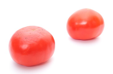 Fresh and old tomato on white bacground