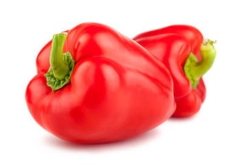 Two red ripe sweet peppers