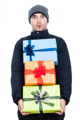 Shocked winter man with presents