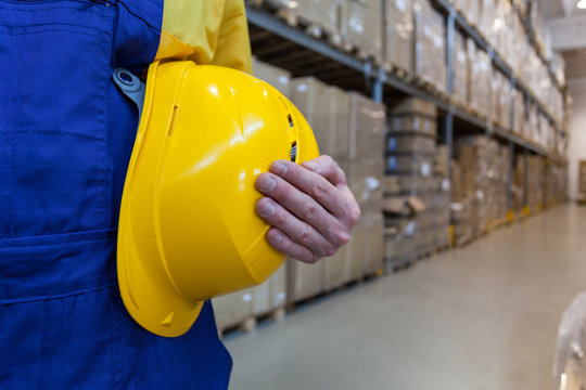 Worker In High Bay Warehouse