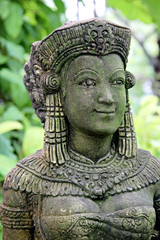 Ancient statue of a woman in the garden.