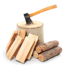 Cut logs fire wood and old axe.