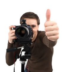 Man with camera. Cheerful young man holding camera and gesturing