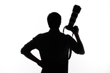 Fototapeta na wymiar Man with camera. Silhouette of man holding camera and holding ha