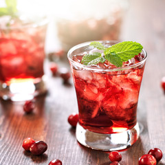 cranberry cocktail with mint garnish.