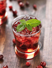 cranberry cocktail with mint garnish.