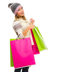 Young girl with bags shows ok gesture