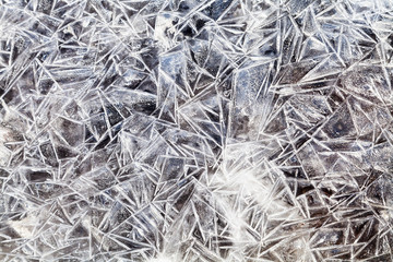 ice crystals over frozen puddle