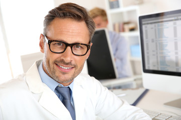 Portrait of handsome doctor wearing eyeglasses