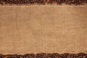 Coffee beans lying on sackcloth - 55930663