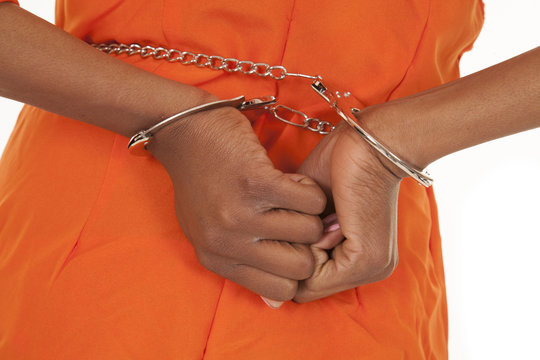 Woman Prisoner Orange Handcuffs Close