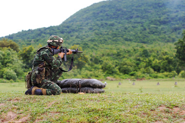 Shooter who has just taken a shot with an assault rifle