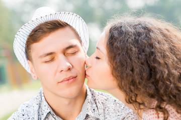 girl kissing a man on the cheek