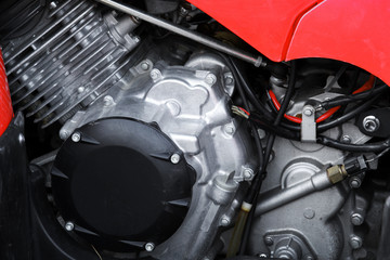 Obraz premium Sport motorcycle engine under red cover