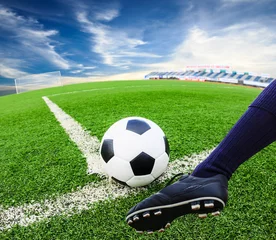 Foto op Plexiglas Voetbal foot kicking soccer ball