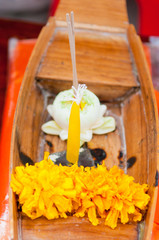 Little wooden boat and flower show pray river concept