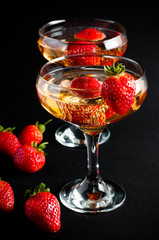 Two glasses of cold champagne with strawberries