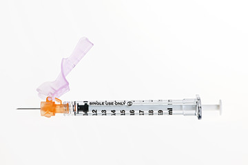 Syringe over white