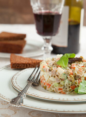 Russian traditional salad Olivier. Selective focus