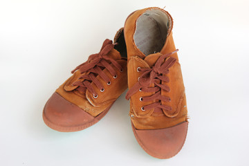 pair of old brown canvas shoes