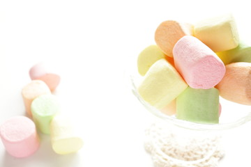 colorful masrhmallow on glass bowl