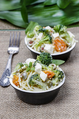 Vegetarian pasta with broccoli, ricotta, basil, carrot and olive