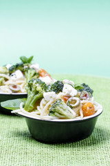 Vegetarian pasta with broccoli, ricotta, basil, carrot and olive