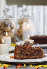 Fototapeta na wymiar Chocolate cake, beautiful party table setting with candles