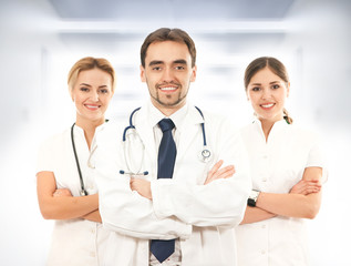 A team of young and smart medical workers in white clothes