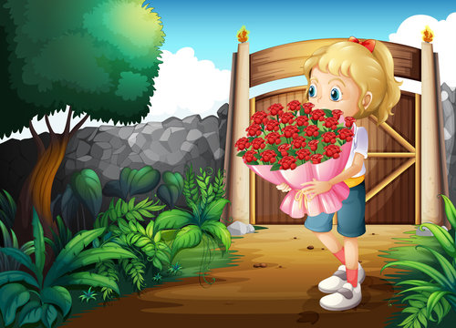A girl inside the gate holding a bouquet of flowers